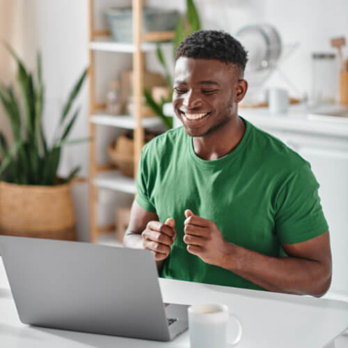 A young professional man in a virtual Zoom meeting discussing investment strategies and comprehensive wealth planning with financial advisors.