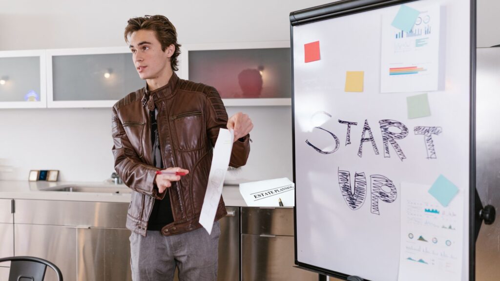Young entrepreneur presenting a startup business plan.
