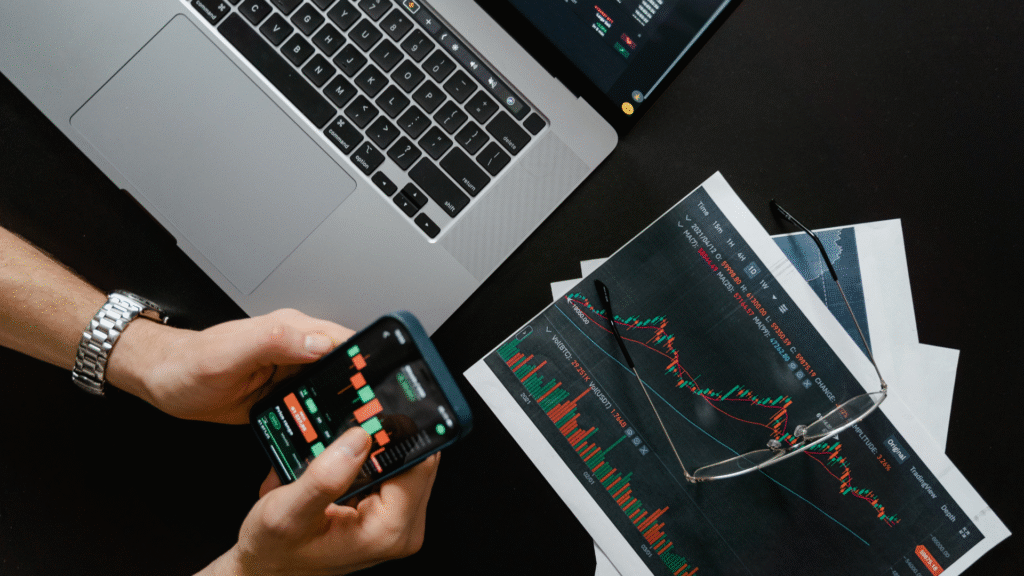 Financial planning with mobile trading app and printed stock performance reports