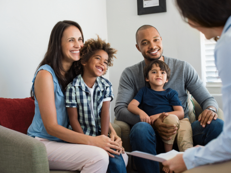Smiling family meeting with financial advisor at home