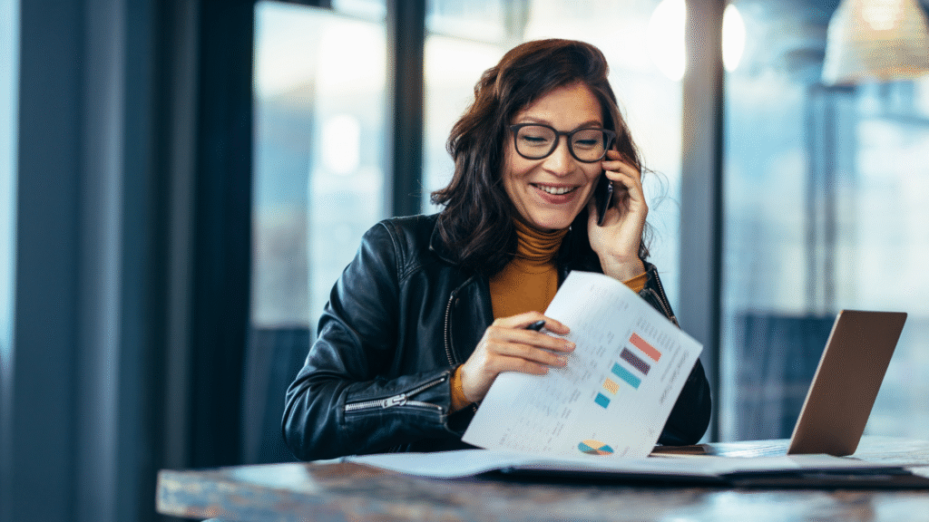 Advisor explaining business report with charts and statistics
