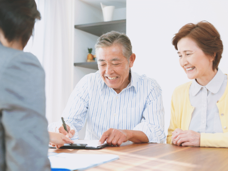 Senior couple meeting with a financial advisor for succession and estate planning
