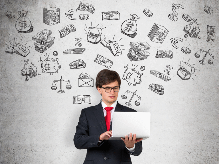 Young businessman using a laptop with financial and investment icons drawn on a wall, representing investing fundamentals and compounding growth.