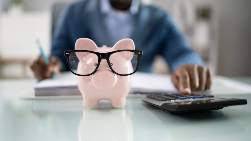 Piggy bank wearing eyeglasses symbolizing financial planning and budgeting