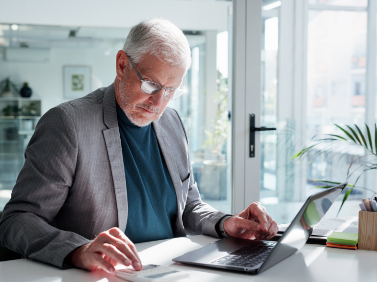 Pre-retirement investor in his 50s analyzing portfolio risk and retirement planning decisions