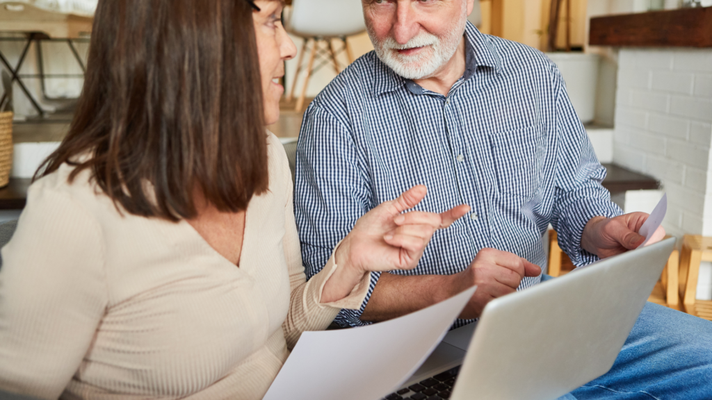 Retired couple planning flexible retirement income and sustainable withdrawal strategies together