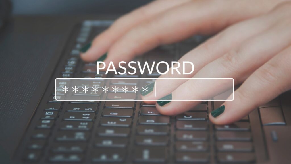 Use strong, unique passwords illustration showing hands typing a password on a laptop keyboard for online account security